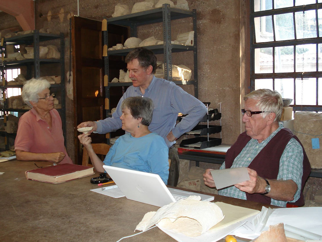 Ron Stroud studies pottery with fellow scholars in the Corinth Museum in 2008.